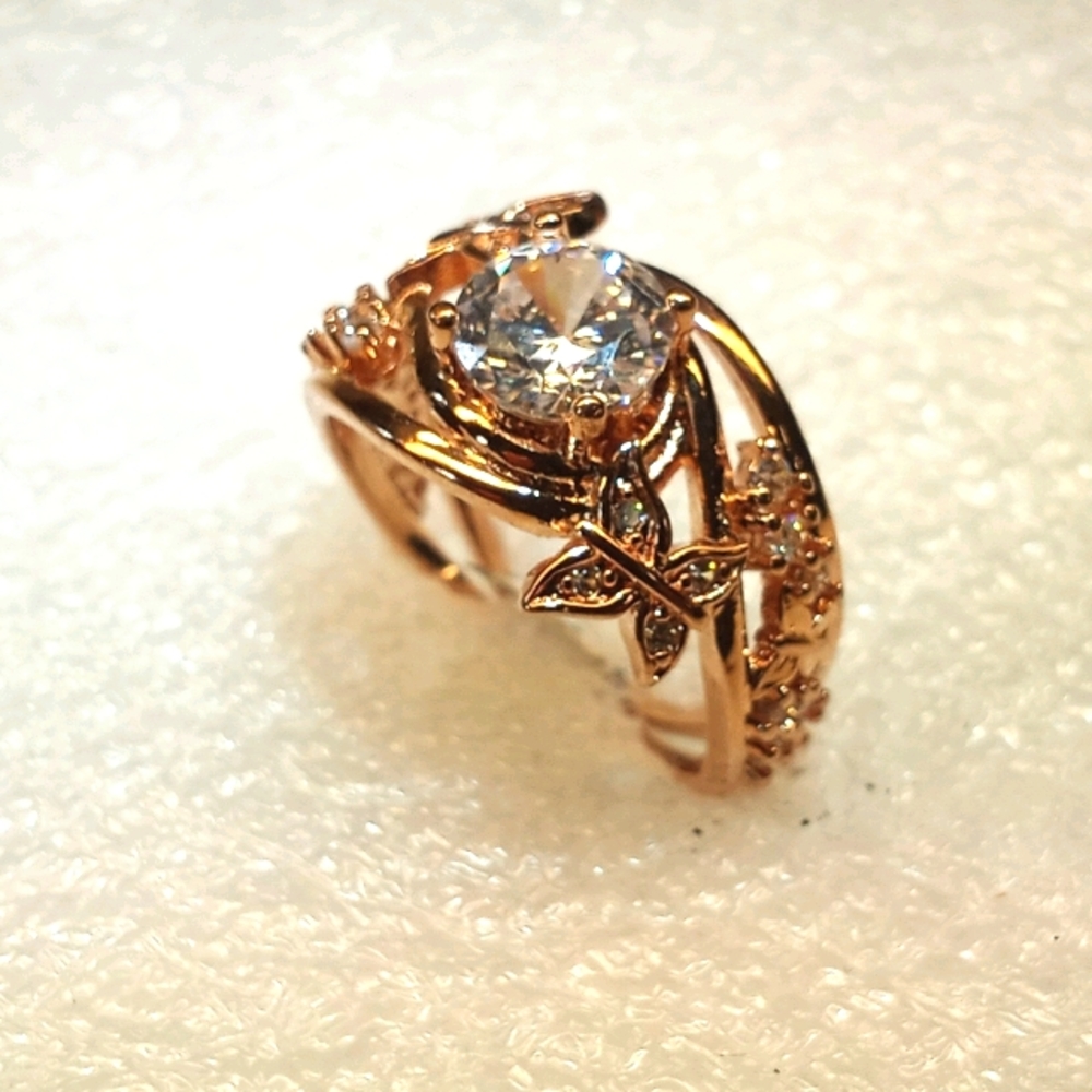 Rose gold filled with white sapphire center stone.